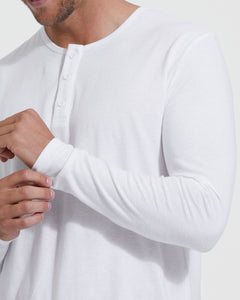 True ClassicMan wearing All White Classic Henley, adjusting sleeve cuff.