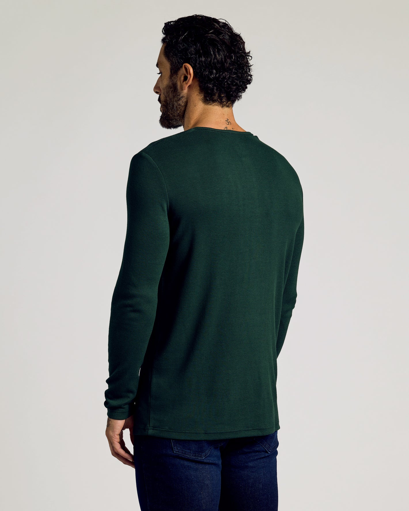 Back view of model in Kale Waffle Long Sleeve Henley.