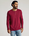 Man wearing Pinot Waffle Long Sleeve Henley, showcasing textured, fitted design.