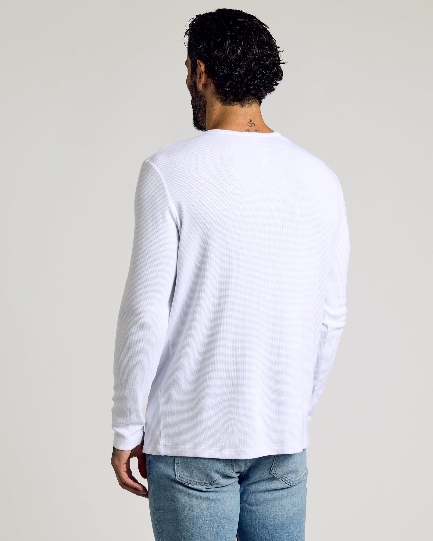 Man wearing Waffle Long Sleeve Henley from 6-Pack, white variant.