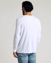 Man in Waffle Long Sleeve Henley, white, with jeans, viewed from behind.