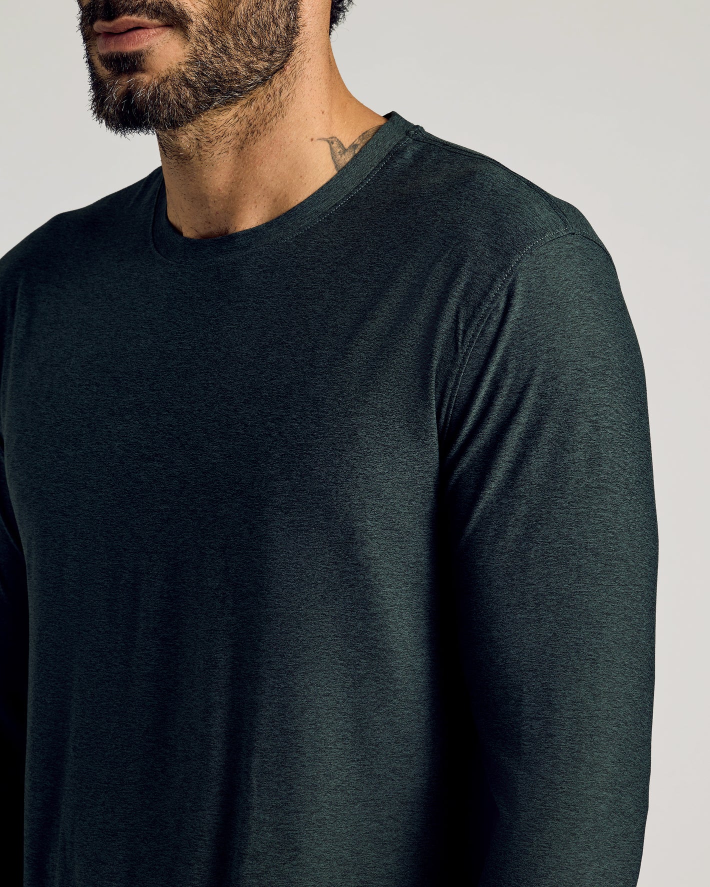 Man wearing Dark Heather Forest Active Long Sleeve Crew T-Shirt.