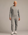 Man in Dark Heather Gray Fleece French Terry Pullover Crew Neck.