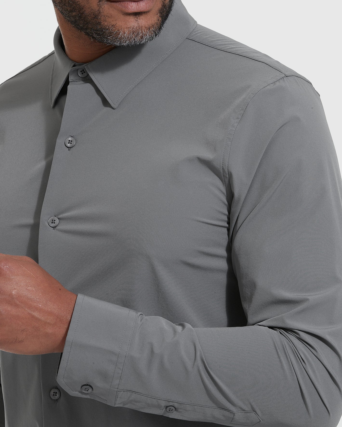 Man wearing Carbon Lightweight Dress Shirt, showcasing fit and button details.