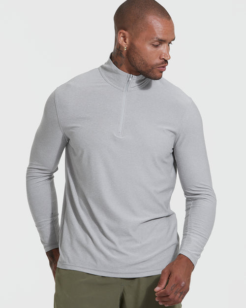 Man wearing Light Heather Gray Active Quarter Zip Shirt with olive pants.