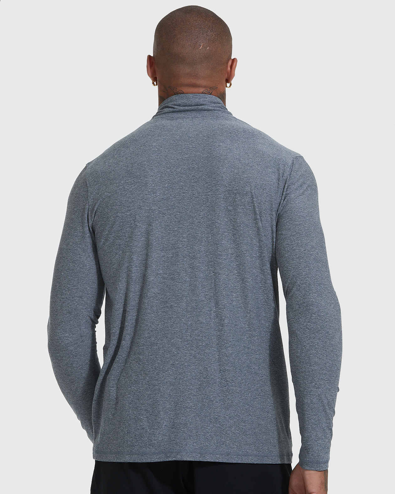 Man wearing Heather Navy Active Quarter Zip Shirt, showcasing its athletic fit.