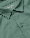 Moss Long Sleeve Linen Shirt, close-up of collar and buttons.