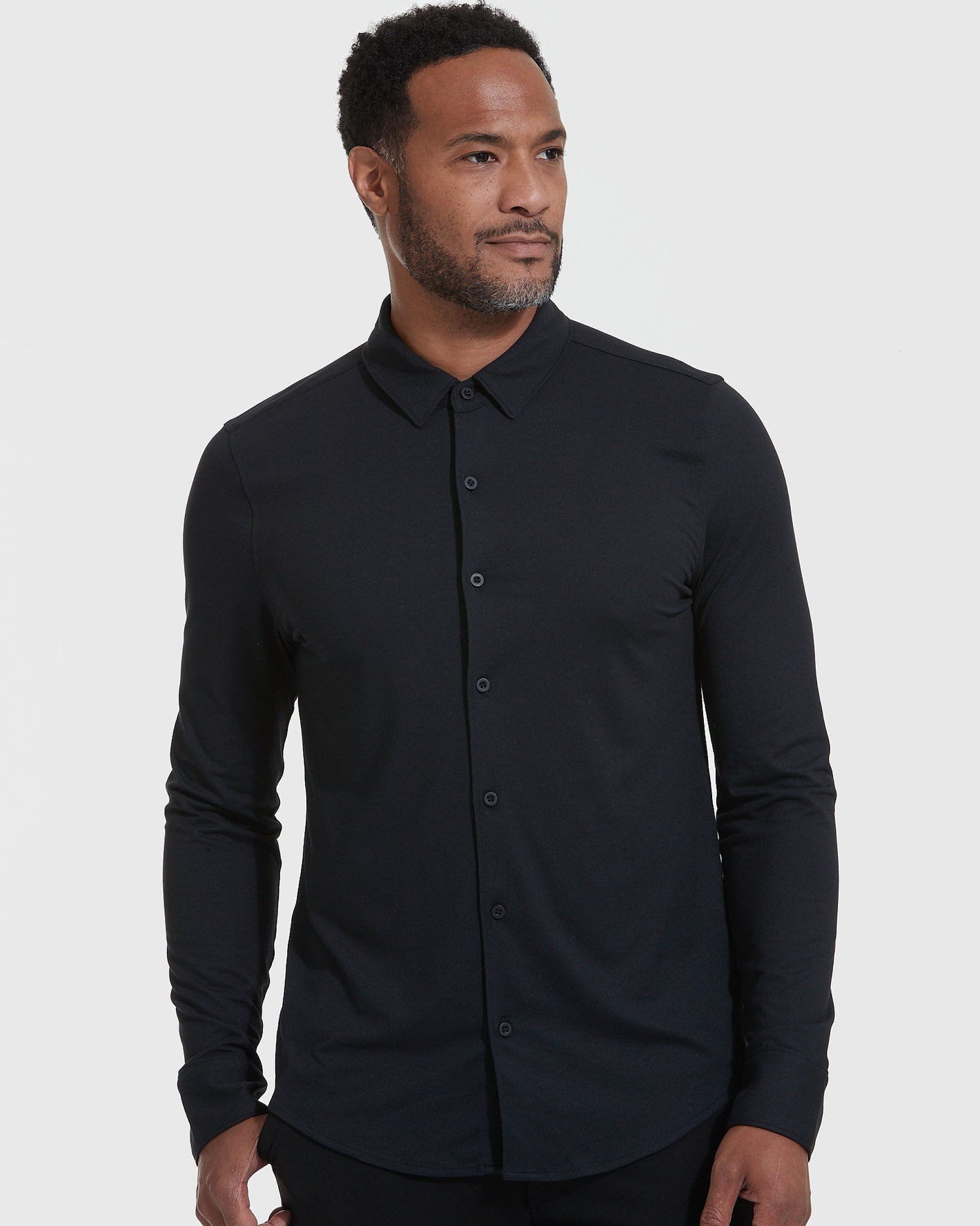 Man in Long Sleeve Do-It-All Comfort Shirt, relaxed slim fit.