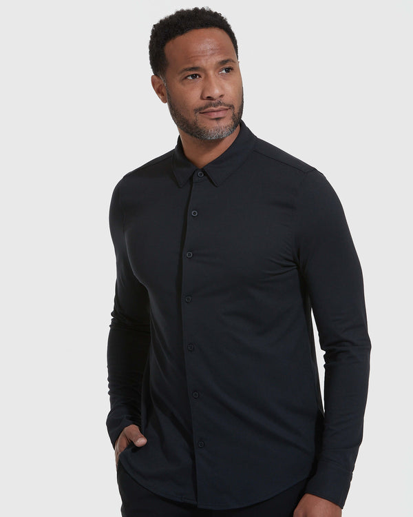 Model wearing Black Long Sleeve Do-It-All Comfort Shirt, hand in pocket.