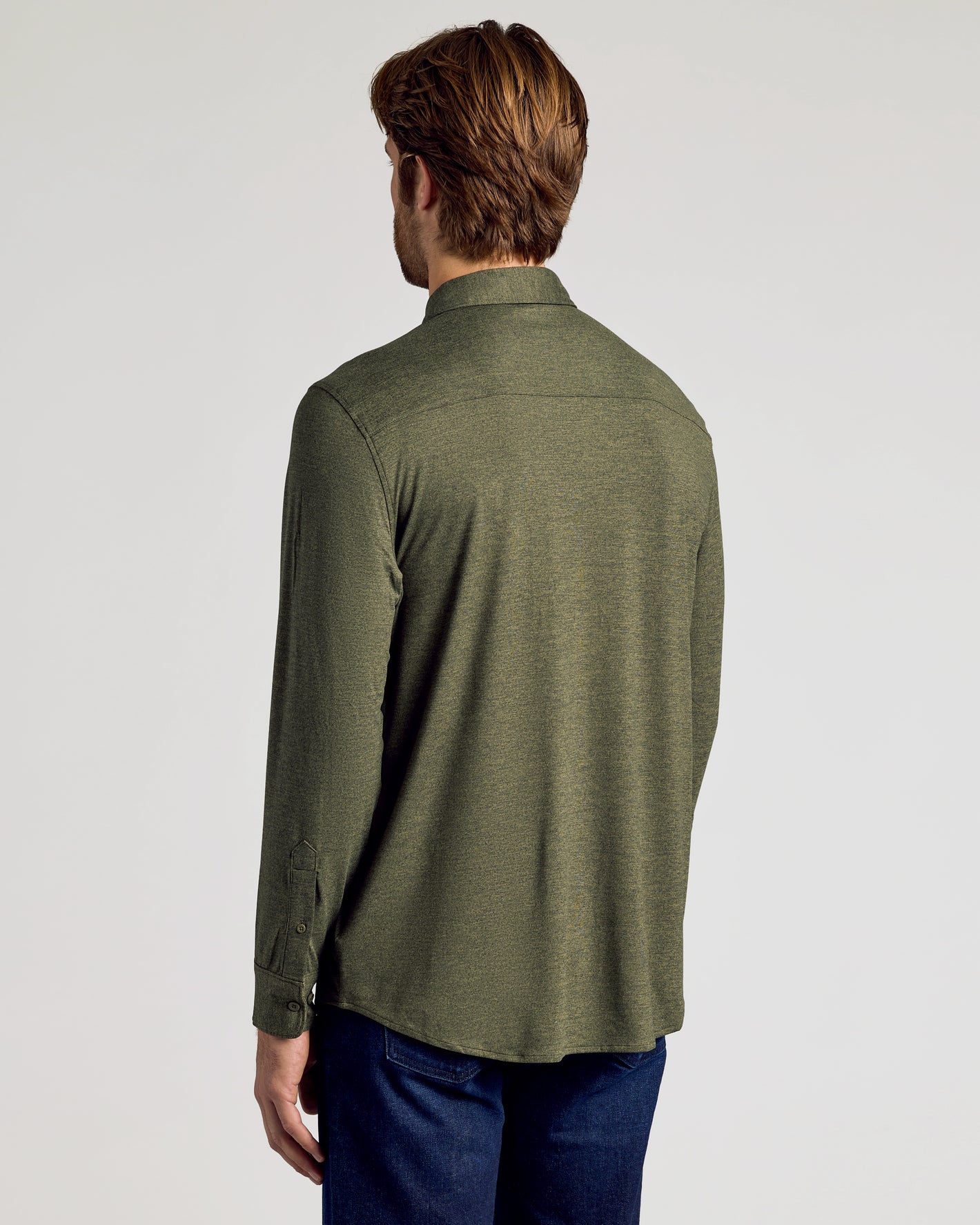 Man wearing Staple Long Sleeve Do-It-All Comfort Shirt, back view.