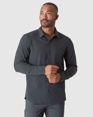 Man wearing Charcoal Heather Gray Long Sleeve Ripstop Commuter Shirt.