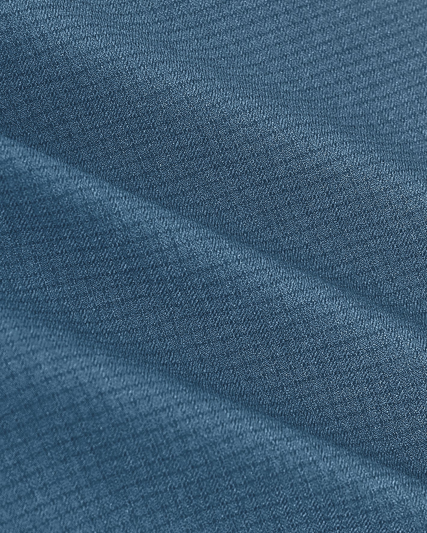 Fiord Long Sleeve Ripstop Commuter Shirt's blue fabric close-up, showing texture.