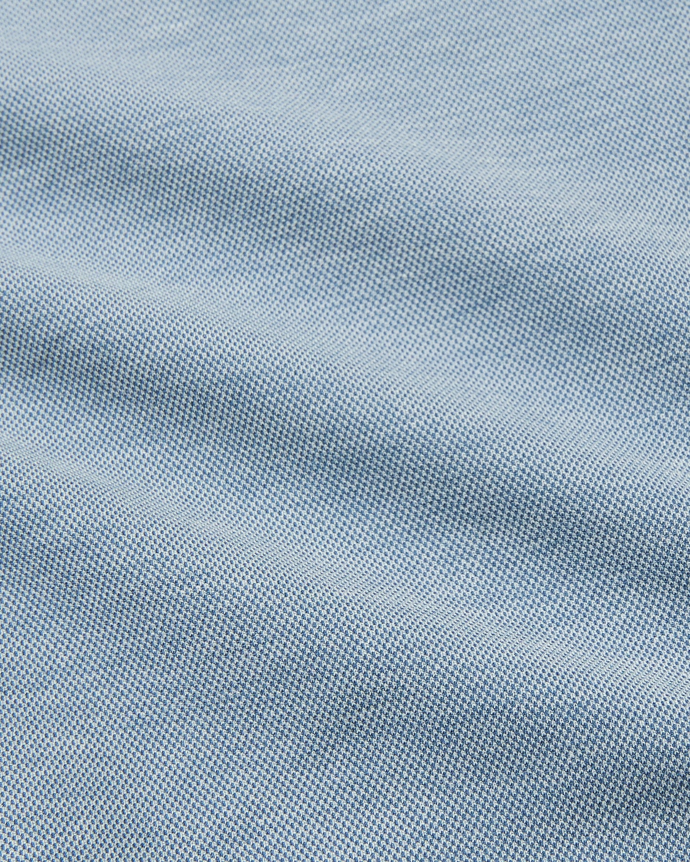 Blue Stretch Oxford 2.0 fabric close-up, showcasing its detailed weave.