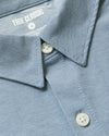 Blue Stretch Oxford 2.0 shirt with collar, buttons, and TRUE CLASSIC label.
