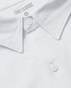 White Stretch Oxford 2.0 close-up with collar, buttons, and TRUE CLASSIC label.