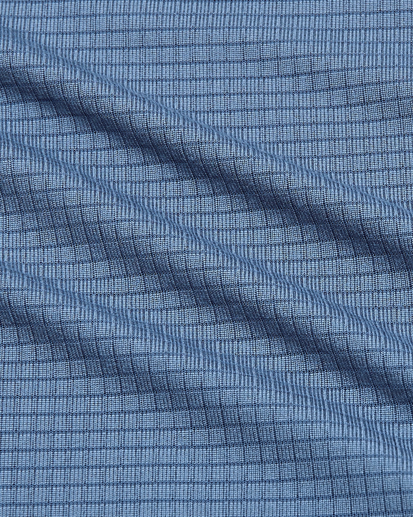 Fiord Active Mesh Crew's light-blue textured fabric close-up.