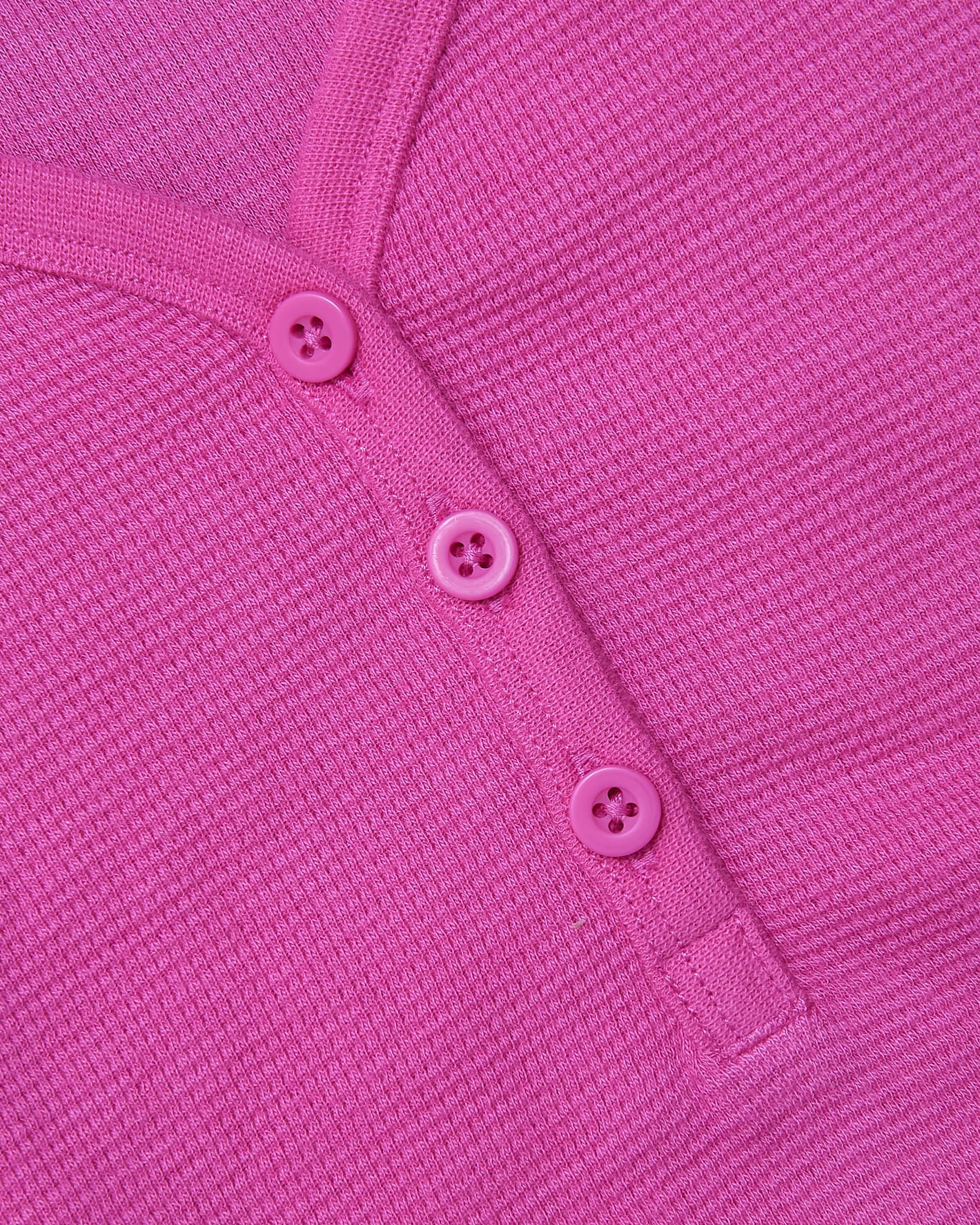 Womens Electric Fuchsia Waffle Long Sleeve Boxy Henley close-up with button placket.