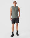 Heather Forest Sleeveless Active Muscle Tee on fit man, showcasing relaxed fit.