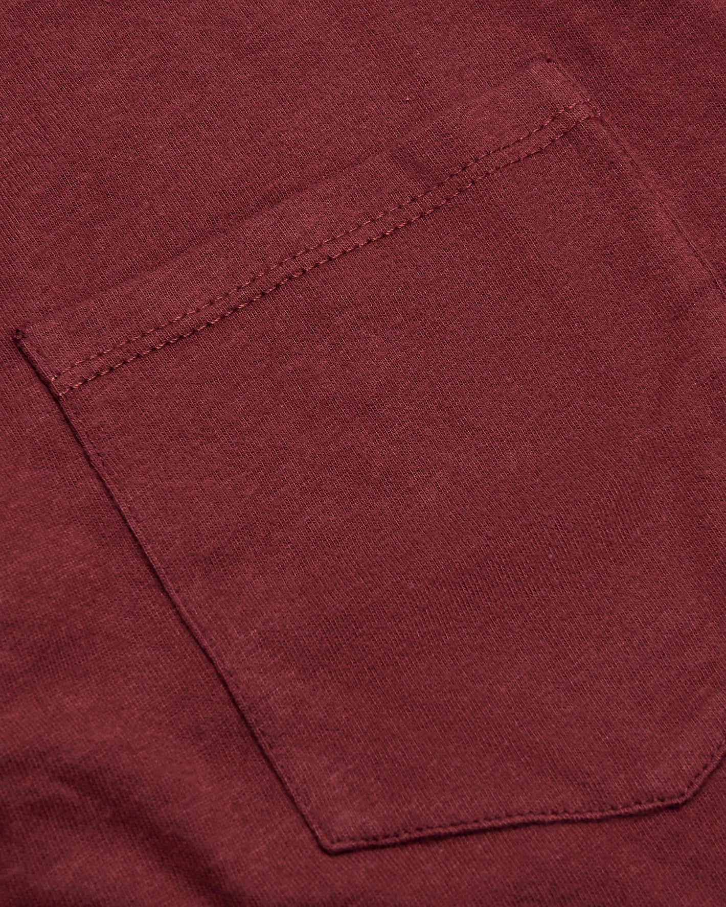 Claret Pocket Crew Tee featuring a knit texture and stitched pocket.