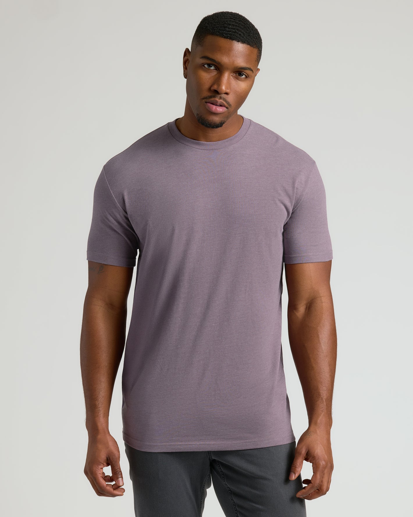 Man wearing Dark Heather Amethyst Tall Crew Neck T-Shirt, straight hem.