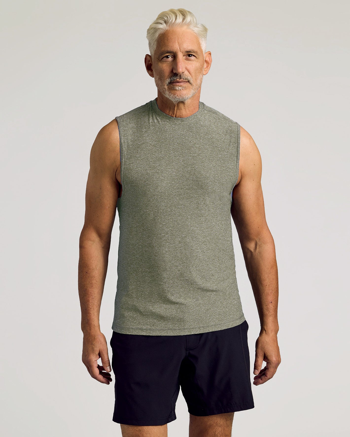 Middle-aged man in Heather Military Green Sleeveless Active Muscle Tee.
