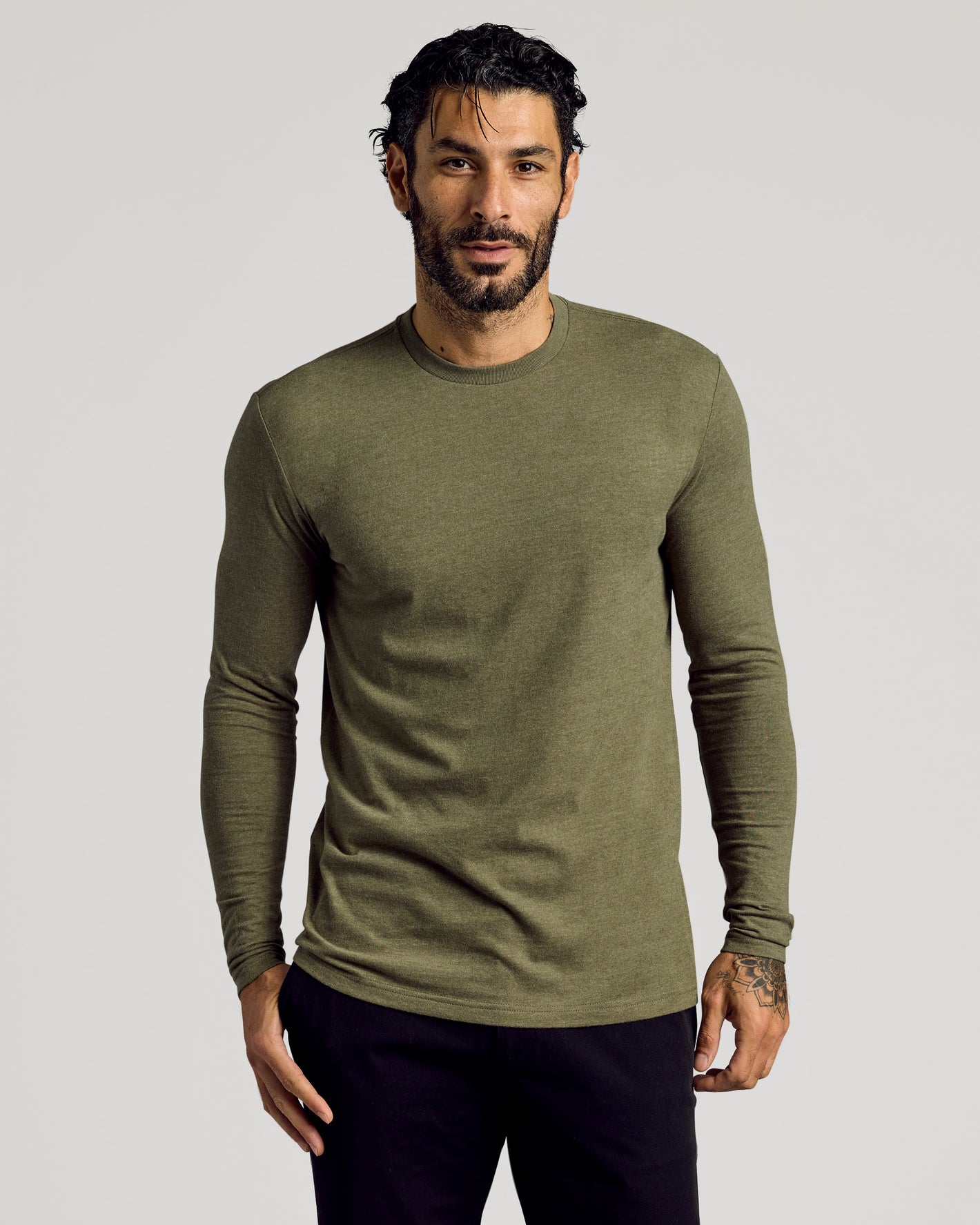 Man wearing Heather Military Green Tall Long Sleeve T-Shirt, showcasing fit.