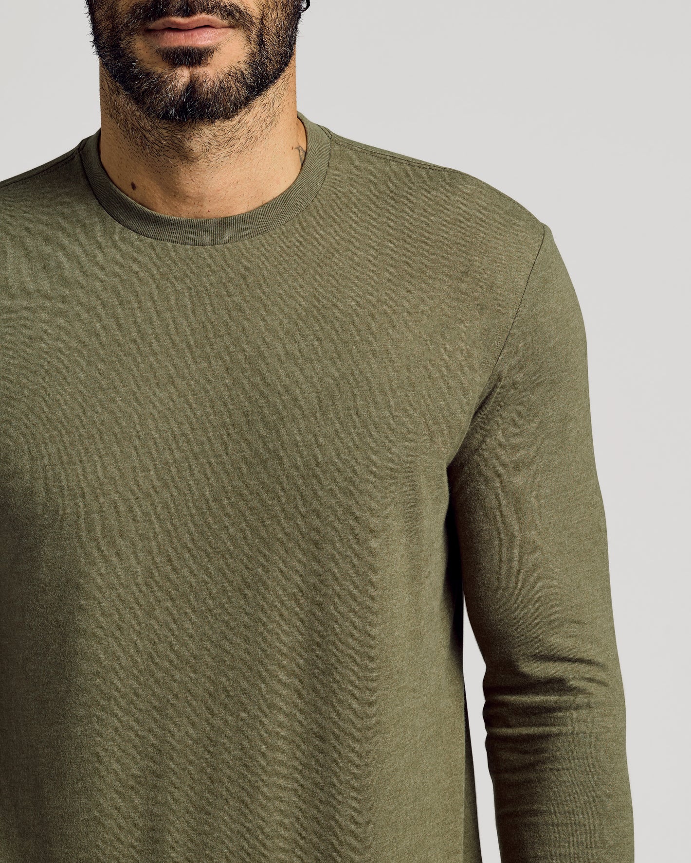 Heather Military Green Tall Long Sleeve T-Shirt on man, emphasizing fit.