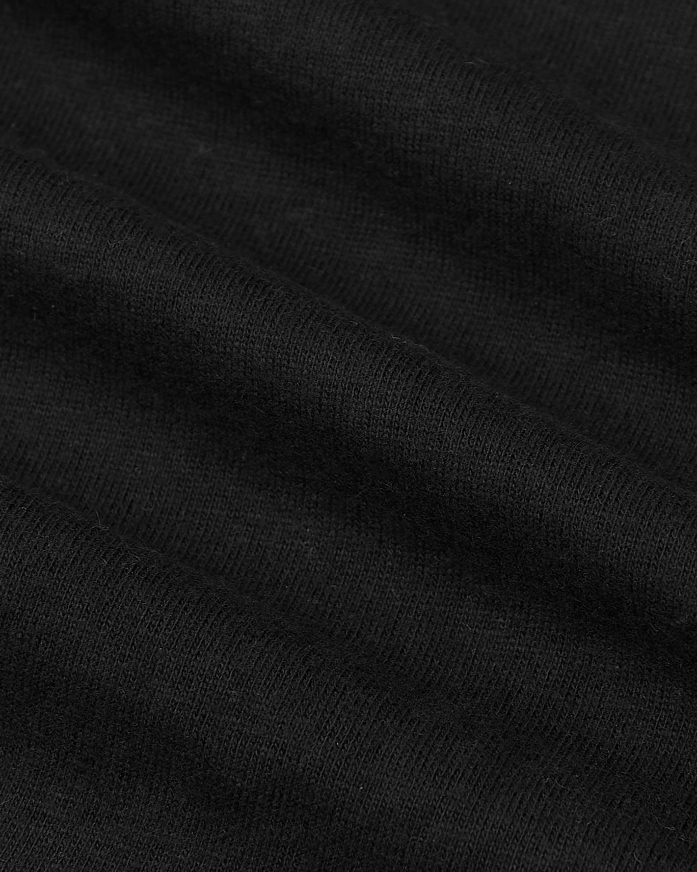 Tall Classic Polo 6-Pack close-up of black knitted fabric.