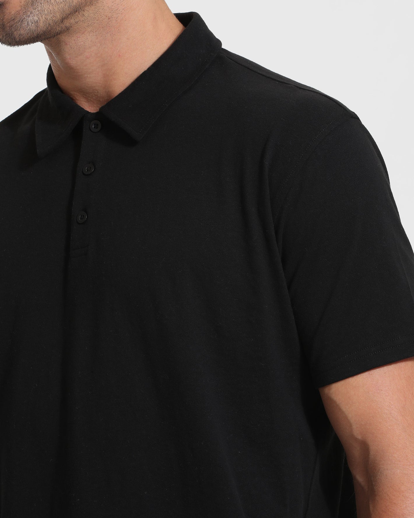 Close-up of All Black Tall Classic Polo collar with buttons.