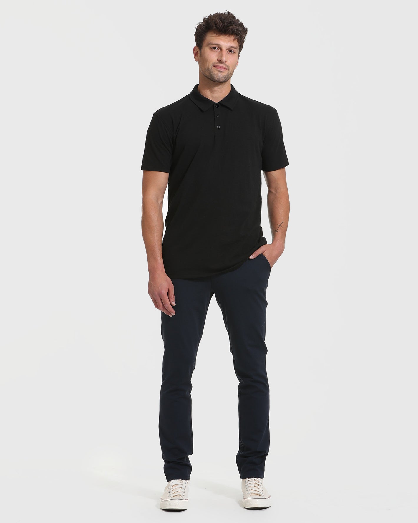 Man wearing Tall Classic Polo 6-Pack with slim trousers and sneakers.