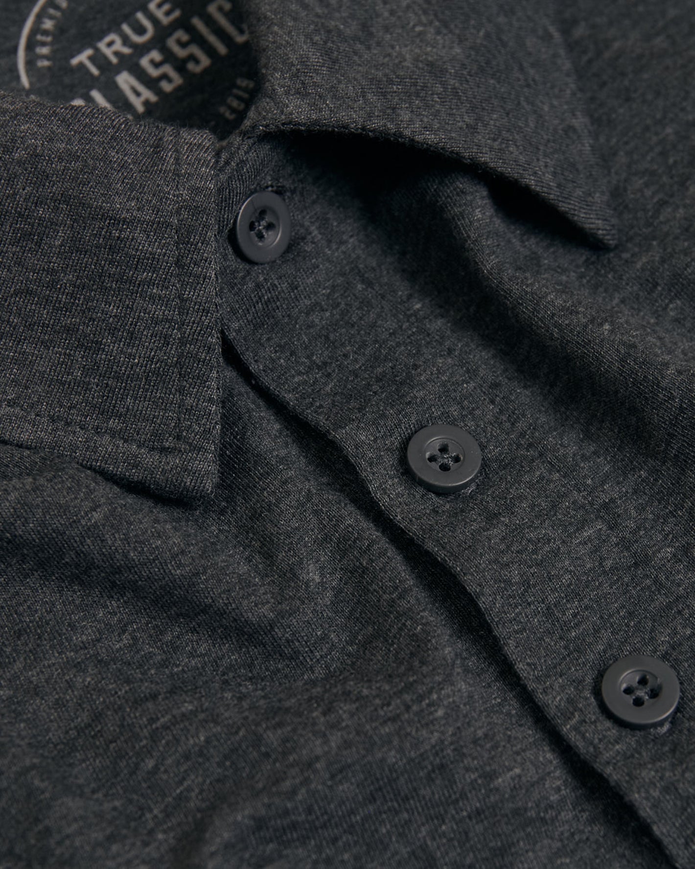 Charcoal Heather Gray Short Sleeve Tall Polo with collar and buttons visible.