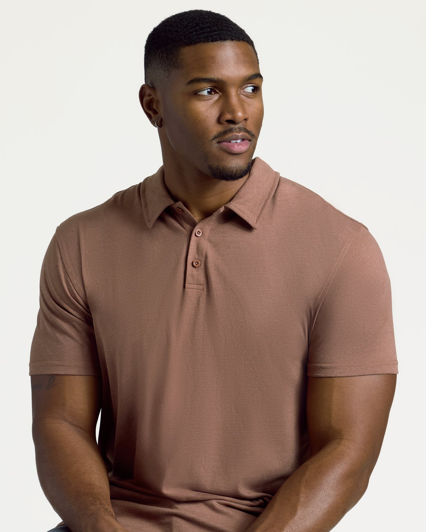 Man wearing Dark Heather Sepia Short Sleeve Tall Polo.