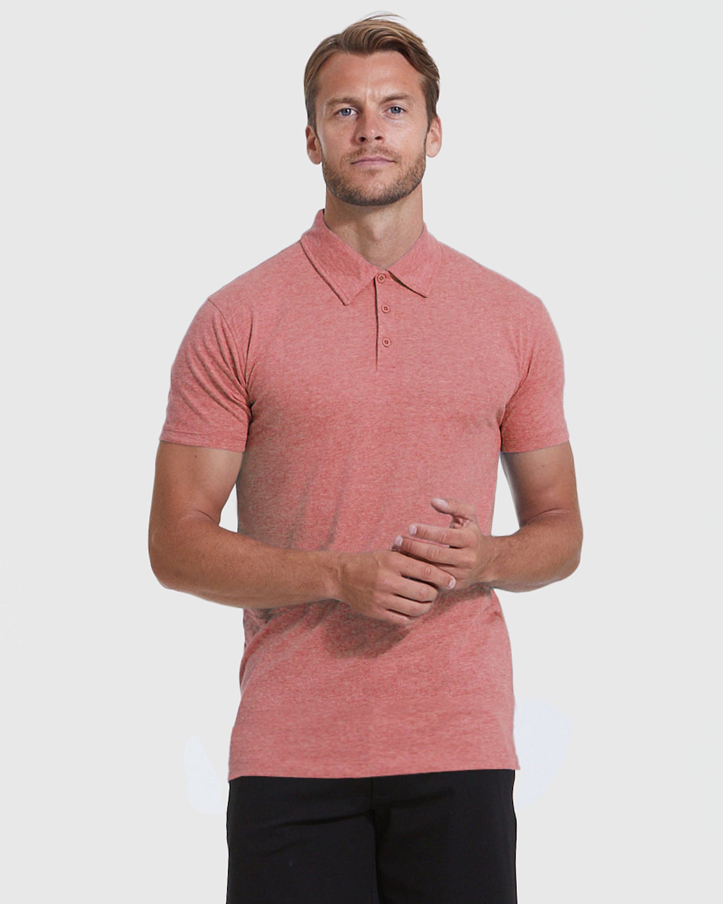 Man wearing Heather Cayenne Short Sleeve Tall Polo.