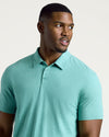 Man wearing Light Heather Greenery Short Sleeve Tall Polo.