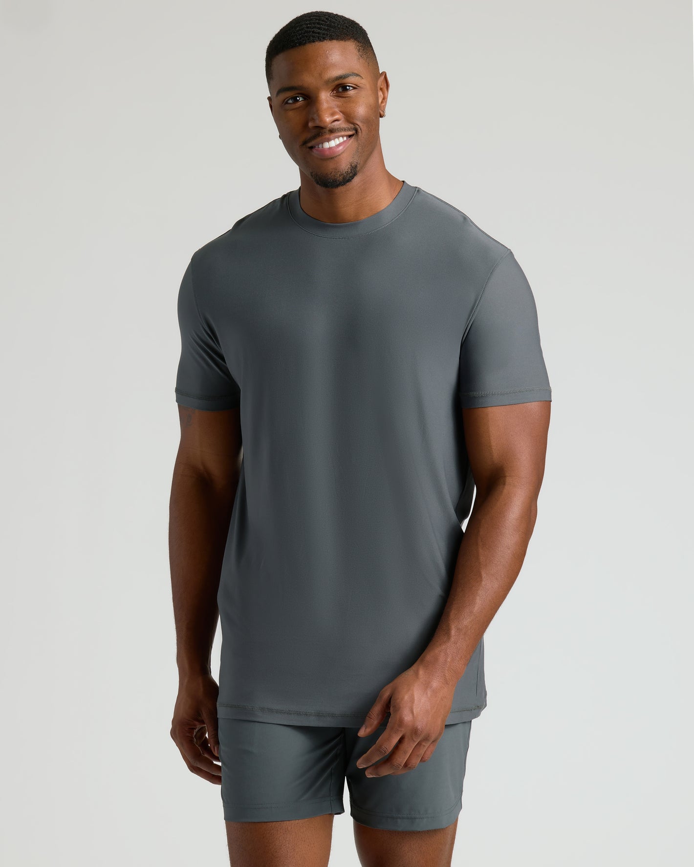 Tall Active Crew 3-Pack modeled by a smiling man in slate-gray outfit.