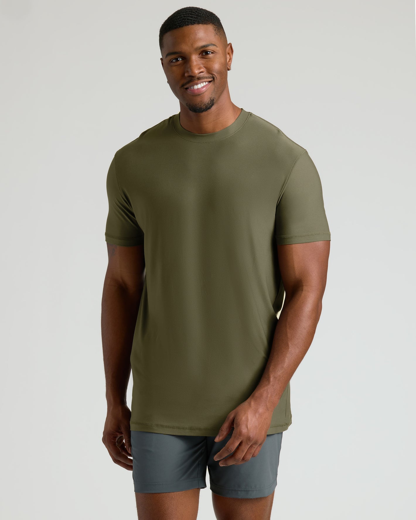 Tall Active Crew 3-Pack model in olive-green tee and gray shorts, smiling.