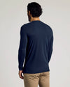 Man wearing Tall Classic Long Sleeve Henley, navy, with khaki trousers.