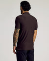 Back view of man in Dark Heather Cocoa Short Sleeve Tall Active Polo.