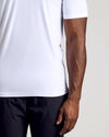 White Short Sleeve Tall Active Polo on person, showcasing fit and sleeve length.