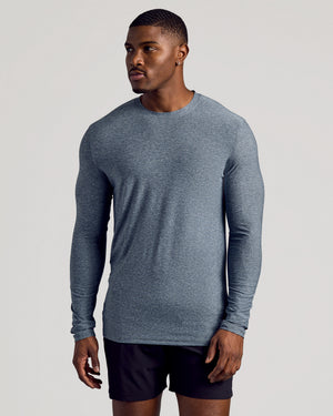 Model in Heather Navy Long Sleeve Tall Active Crew and black shorts.