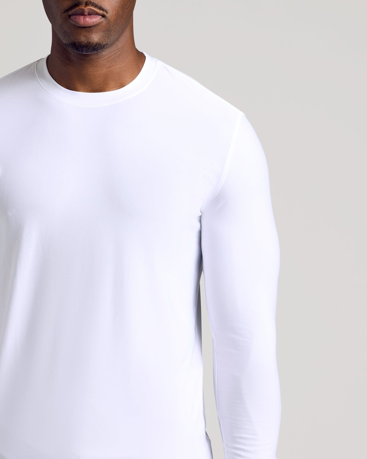 Man wearing White Long Sleeve Tall Active Crew shirt.