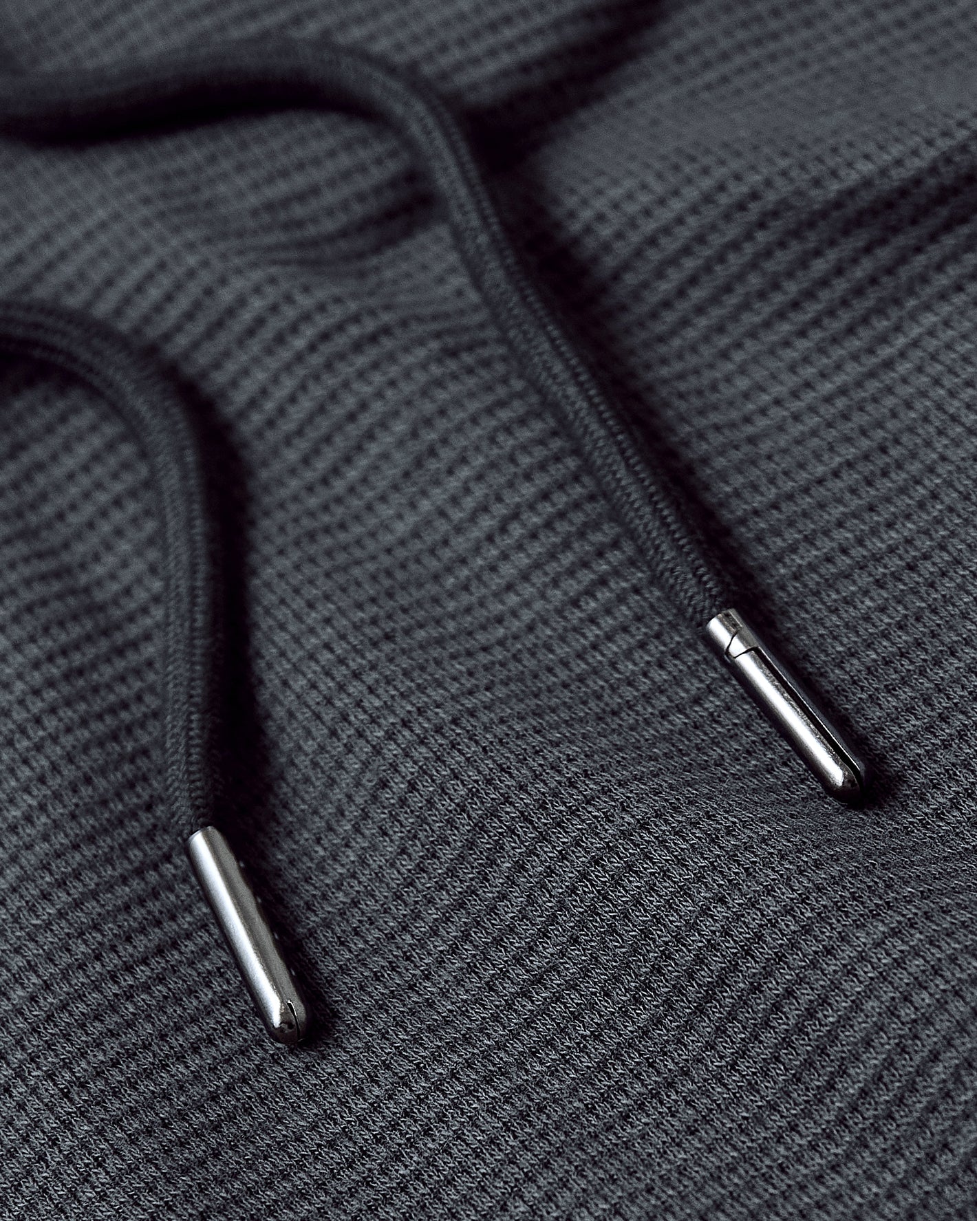 Carbon Tall Waffle Hoodie with black drawcords and shiny metal aglets.
