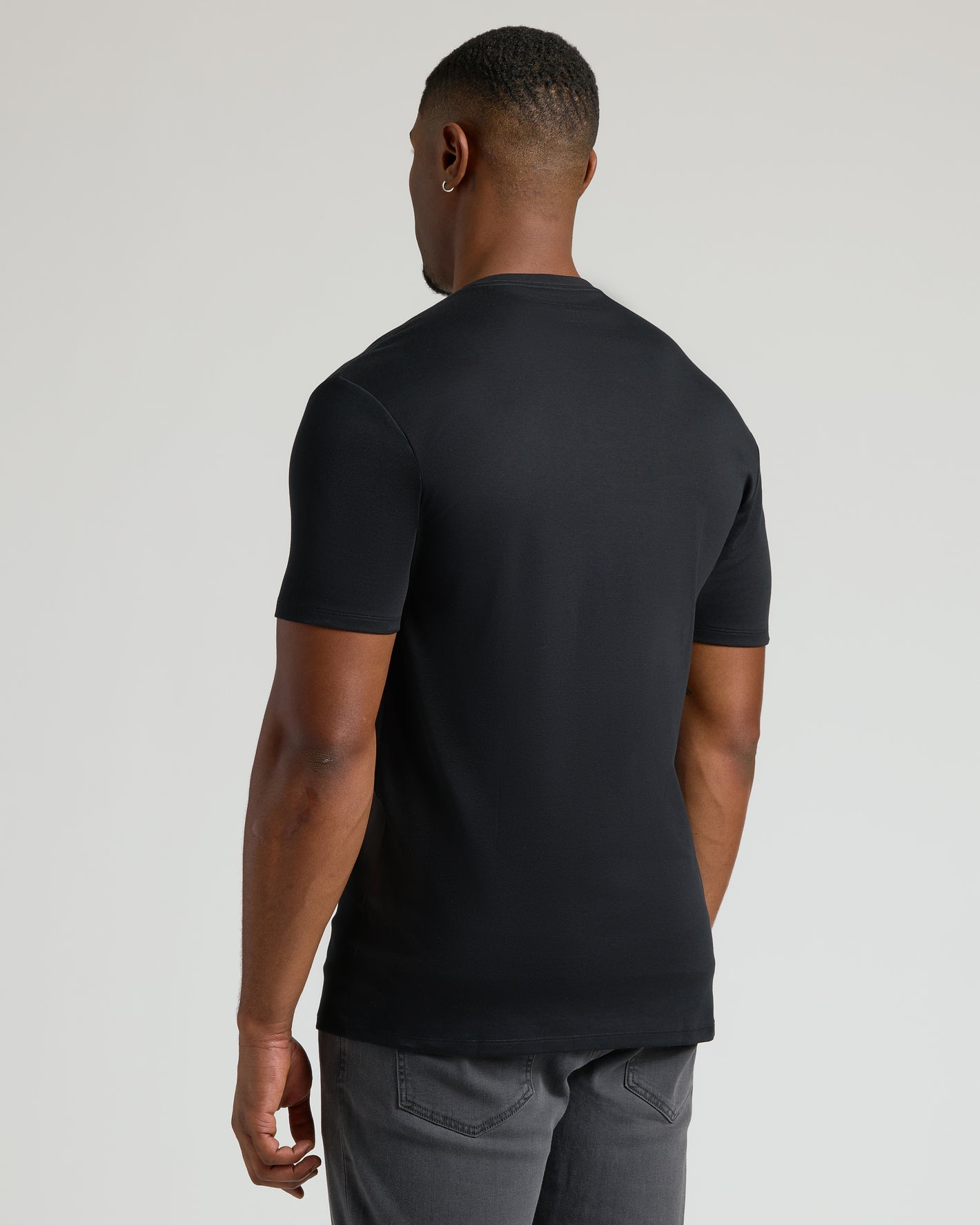 Rear view of man in Black Tall Premium Pima Crew Neck Tee.