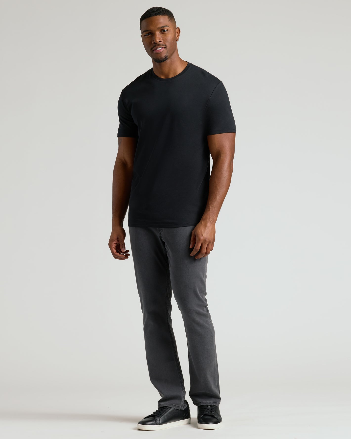 Black Tall Premium Pima Crew Neck tee modeled with charcoal-grey jeans.