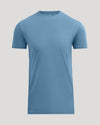 A light blue short-sleeve crewneck t-shirt displayed on a neutral light gray background.