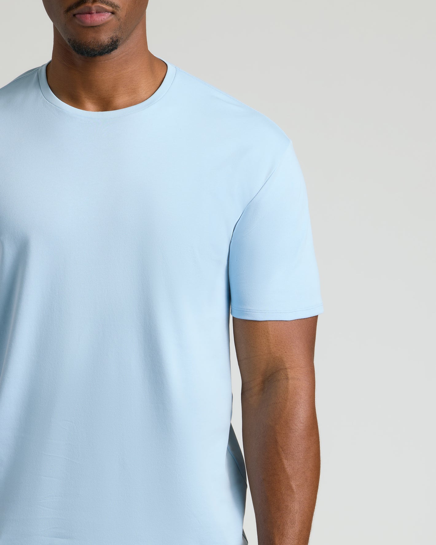 Ether Tall Premium Pima Crew Neck in light blue on model's torso.