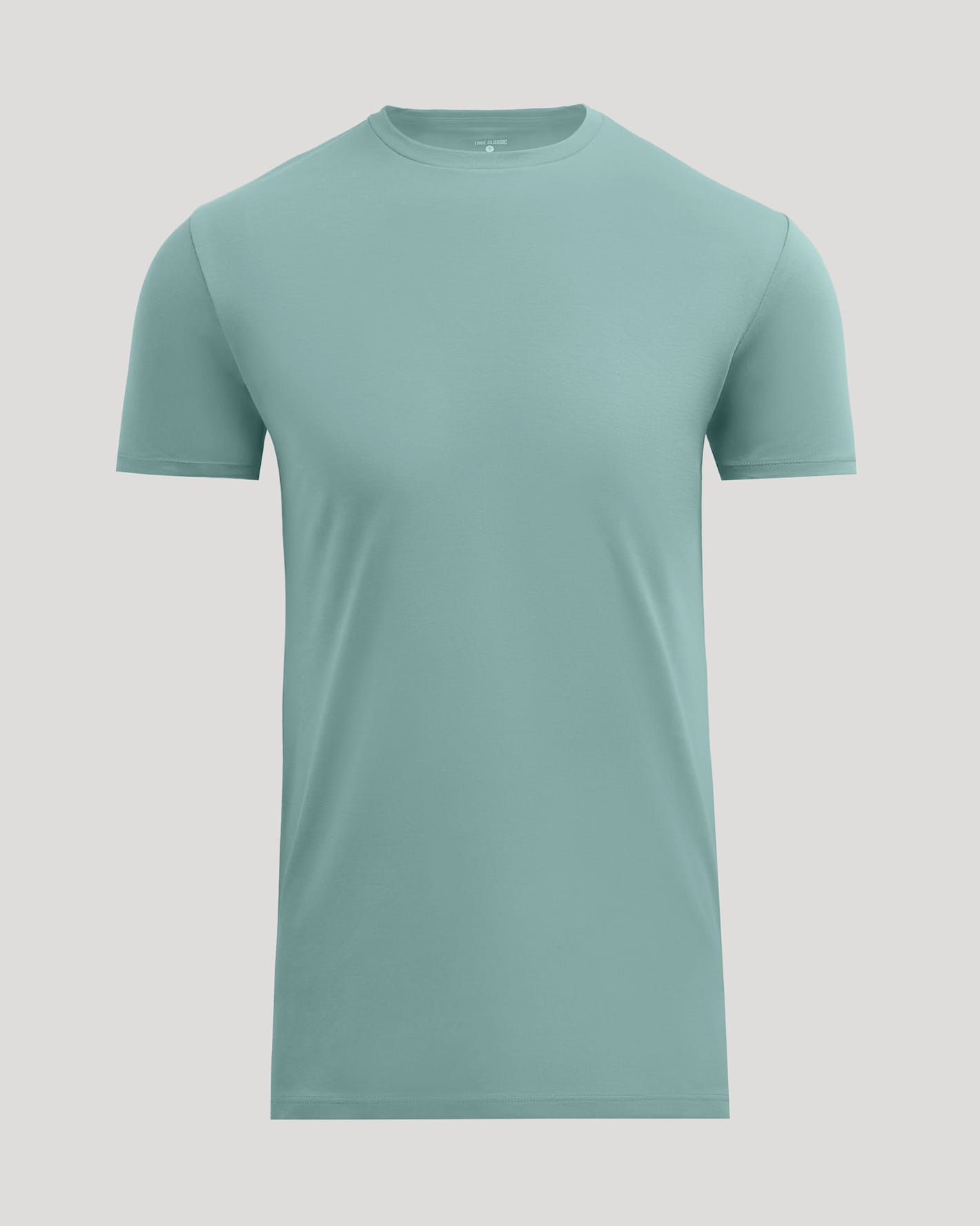 A short-sleeve crewneck t-shirt in a muted sage green color, displayed on a solid light gray background.