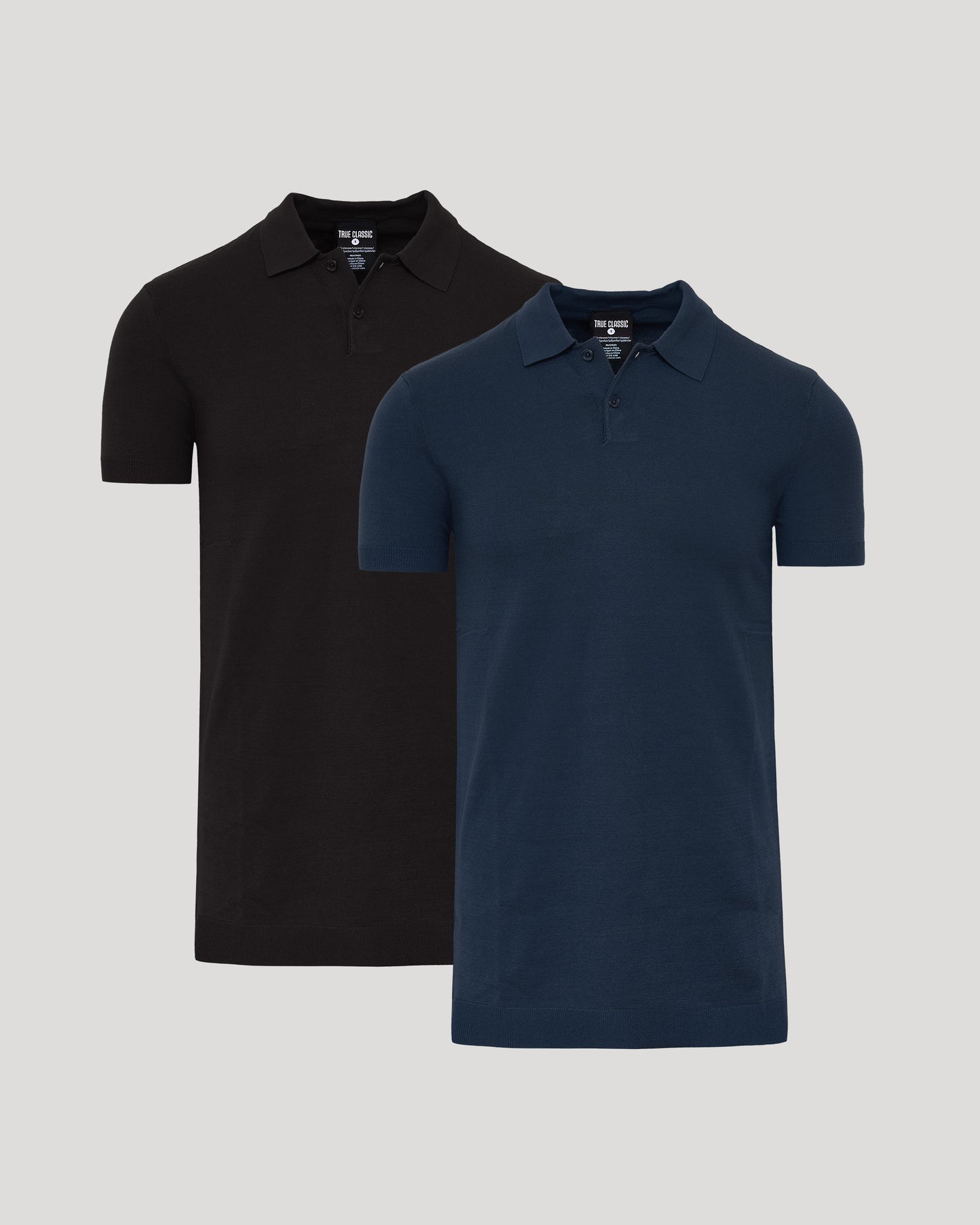 Two polo shirts, one black and one navy, on a light gray background.
