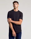 Young man models Wardrobe Classic Tall Curved Hem Crew 10-Pack tee.