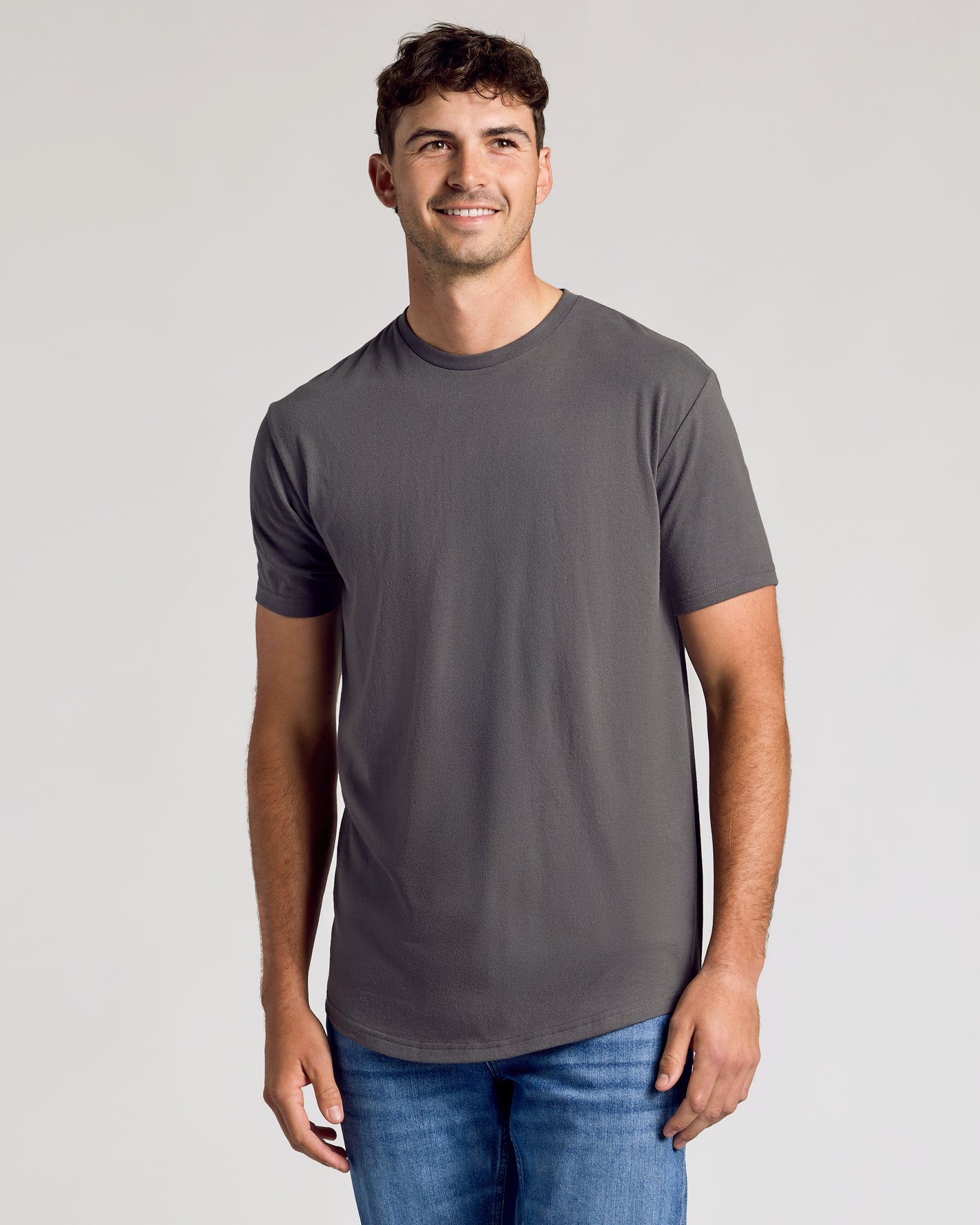 Young male in charcoal-gray Short Sleeve Tall Curved Hem Crew.